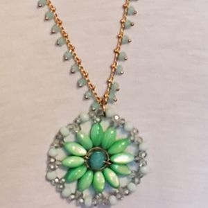Goldtone mint green beaded medallion necklace